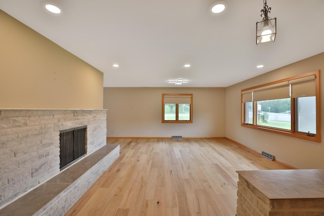 465 W Schrock Rd, Westerville, OH 43081 - unfurnished living room with a fireplace with raised hearth, light wood-style floors, recessed lighting, and baseboards
