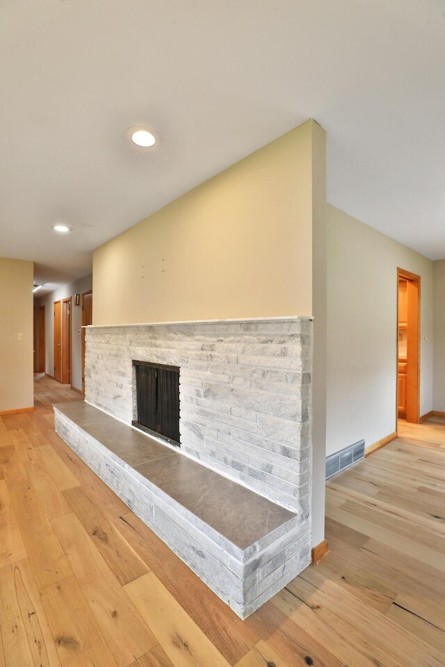 465 W Schrock Rd, Westerville, OH 43081 - unfurnished living room with a brick fireplace, baseboards, light wood finished floors, and recessed lighting
