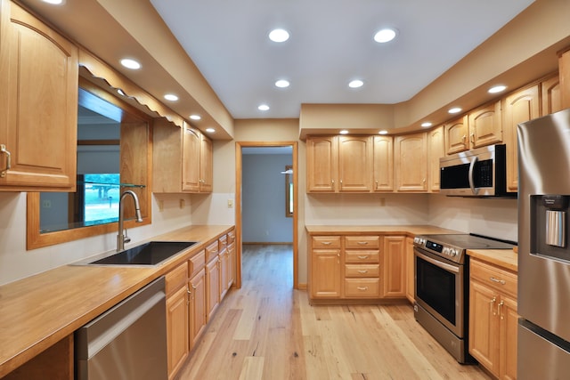 465 W Schrock Rd, Westerville, OH 43081 - kitchen featuring appliances with stainless steel finishes, a sink, light brown cabinets, recessed lighting, and light wood finished floors