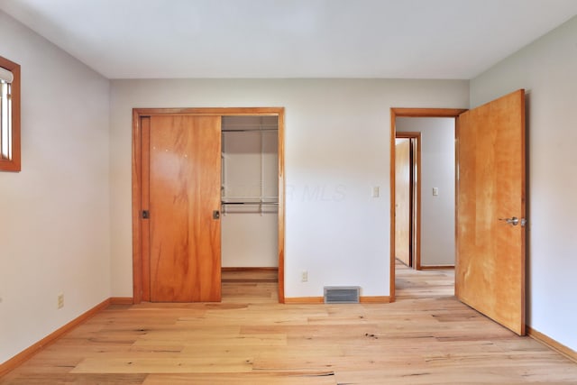 465 W Schrock Rd, Westerville, OH 43081 - unfurnished bedroom featuring baseboards, light wood-style floors, and a closet