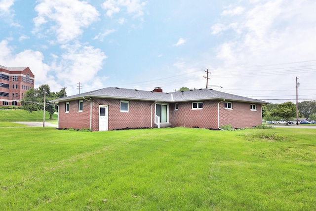 465 W Schrock Rd, Westerville, OH 43081 - rear view of house featuring brick siding, a lawn, and a chimney
