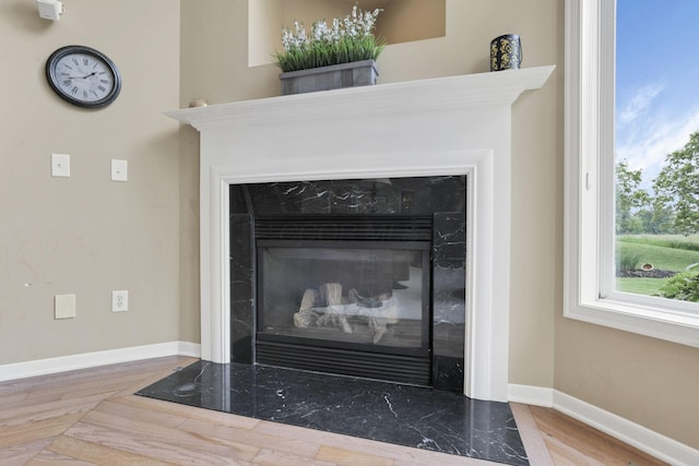 8708 Belworth Sq, New Albany, OH 43054 - detailed view of a high end fireplace, wood finished floors, and baseboards