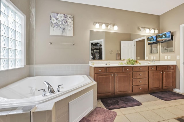 8708 Belworth Sq, New Albany, OH 43054 - full bath with double vanity, a garden tub, tile patterned flooring, and a walk in closet