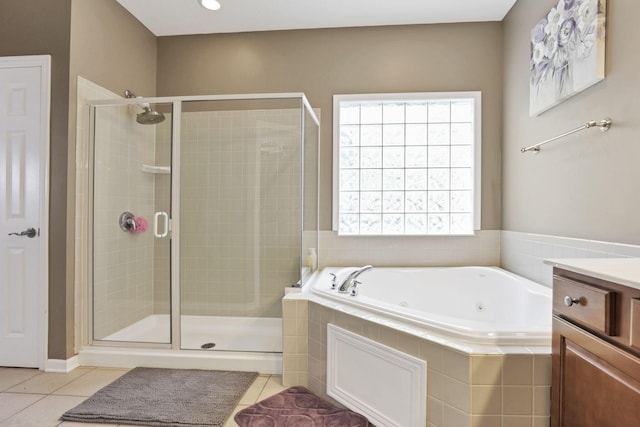 8708 Belworth Sq, New Albany, OH 43054 - bathroom with a jetted tub, a stall shower, tile patterned floors, and vanity