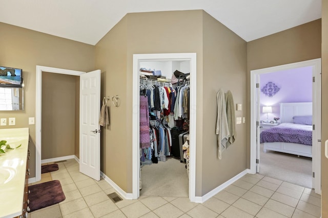 8708 Belworth Sq, New Albany, OH 43054 - interior space featuring light colored carpet, a spacious closet, a closet, baseboards, and light tile patterned floors