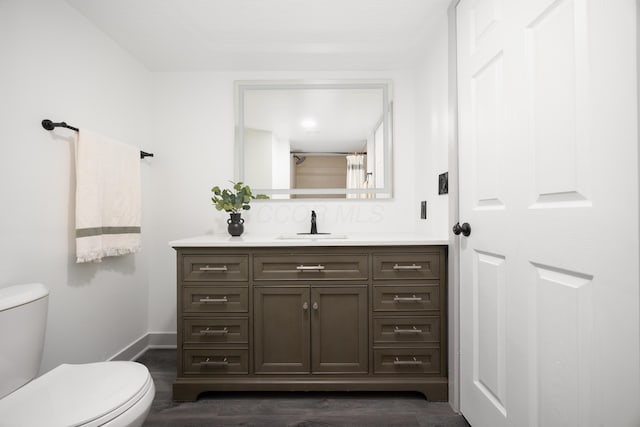 25 Vernon Ave, London, OH 43140 - full bath featuring toilet, vanity, wood finished floors, baseboards, and a shower with curtain