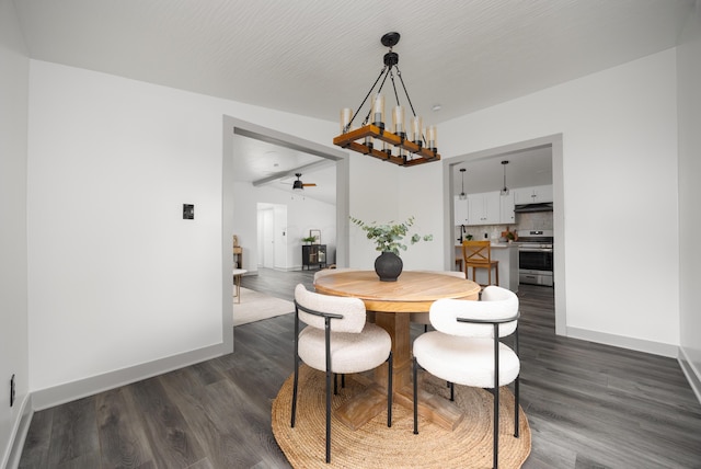 25 Vernon Ave, London, OH 43140 - dining space with dark wood-style floors, a chandelier, baseboards, and a ceiling fan
