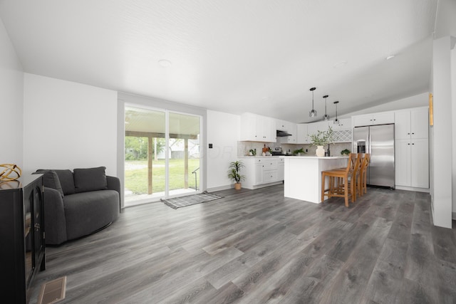 25 Vernon Ave, London, OH 43140 - living area with wood finished floors and lofted ceiling