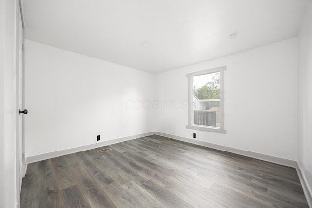 25 Vernon Ave, London, OH 43140 - unfurnished room with dark wood-style floors and baseboards