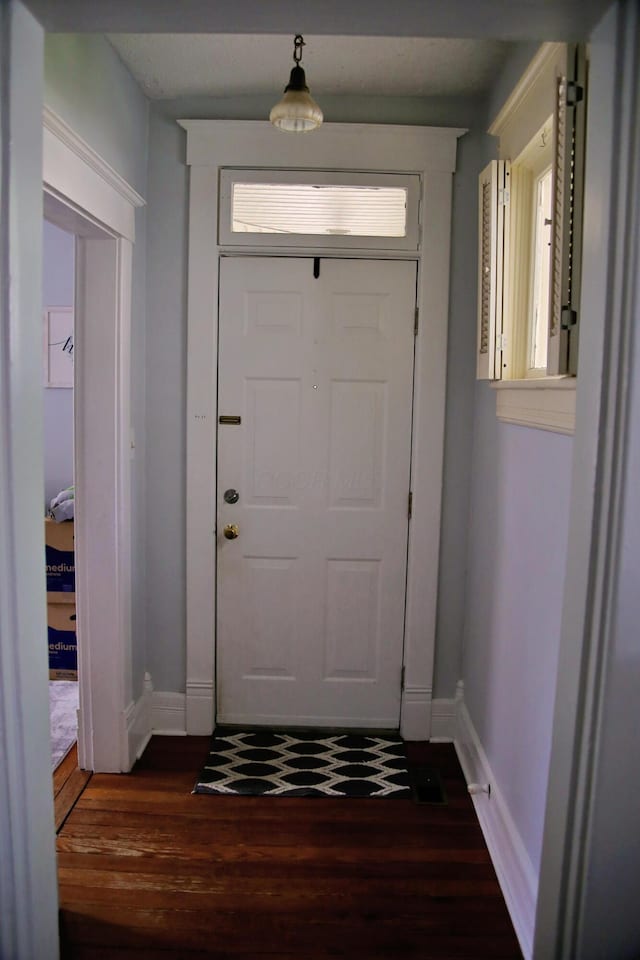 632 E 5th Ave, Lancaster, OH 43130 - doorway featuring dark wood finished floors and baseboards