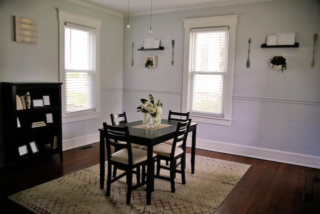 632 E 5th Ave, Lancaster, OH 43130 - dining space featuring baseboards, plenty of natural light, dark wood-style floors, and ornamental molding