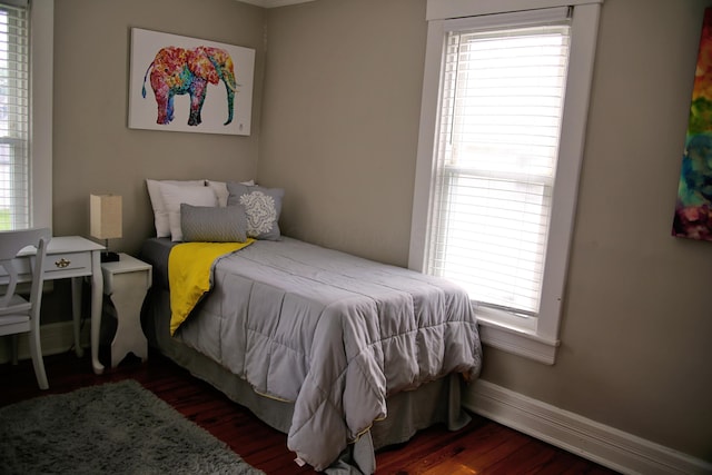 632 E 5th Ave, Lancaster, OH 43130 - bedroom with wood finished floors, multiple windows, and baseboards