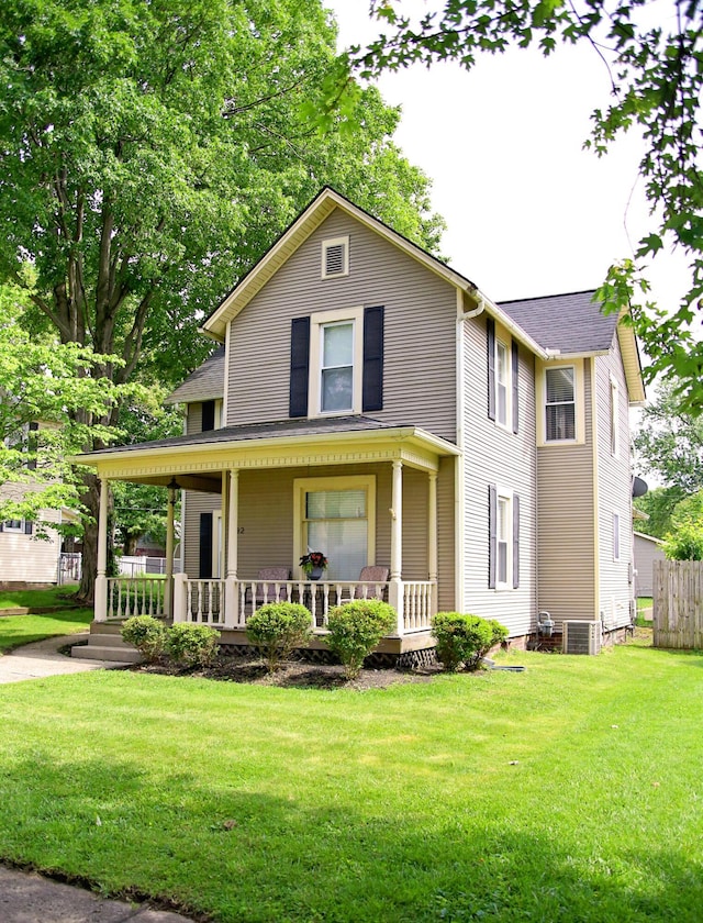 632 E 5th Ave, Lancaster, OH 43130 - view of front of house featuring a front yard, a porch, and central air condition unit