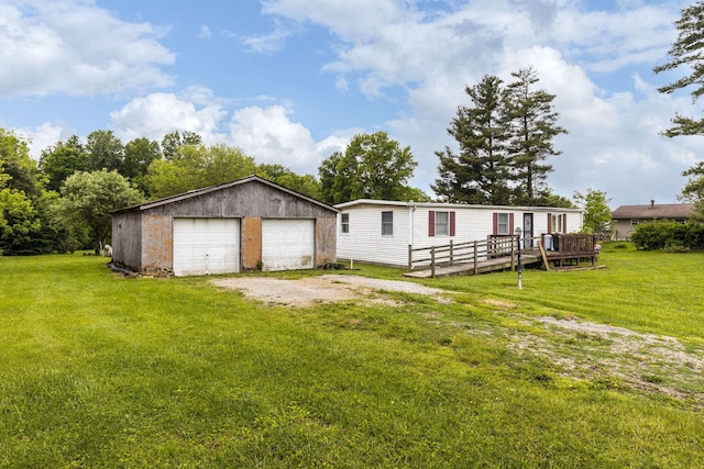11095 High Point Rd, Thornville, OH 43076 - back of property featuring a garage, an outdoor structure, a yard, and a deck