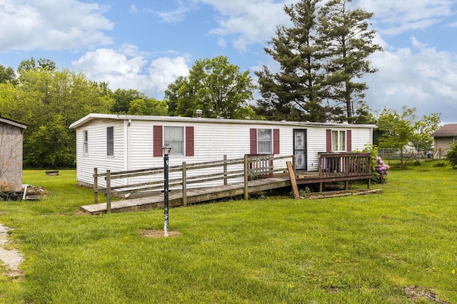 11095 High Point Rd, Thornville, OH 43076 - manufactured / mobile home featuring a front yard and a wooden deck