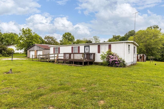 11095 High Point Rd, Thornville, OH 43076 - back of property with a detached garage, an outdoor structure, a wooden deck, and a yard