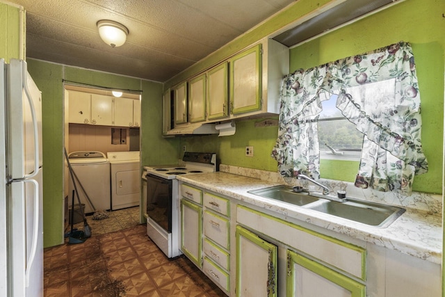 11095 High Point Rd, Thornville, OH 43076 - kitchen featuring white appliances, independent washer and dryer, a sink, and light countertops