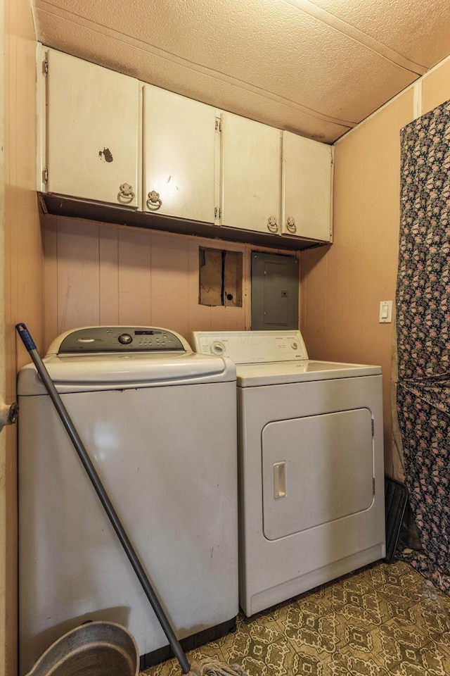 11095 High Point Rd, Thornville, OH 43076 - laundry room featuring cabinet space, electric panel, washing machine and dryer, and wood walls