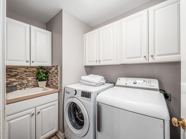 2655 Aikin Cir S, Lewis Center, OH 43035 - laundry area with washing machine and clothes dryer and cabinet space