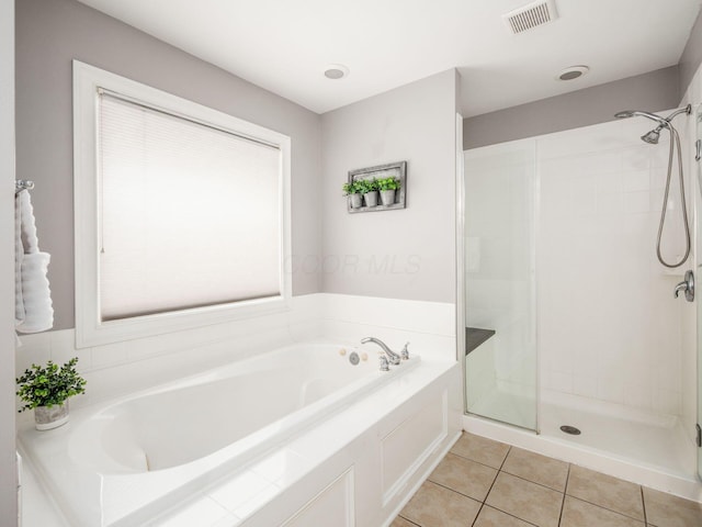 2655 Aikin Cir S, Lewis Center, OH 43035 - full bathroom featuring a bath, a stall shower, and tile patterned flooring