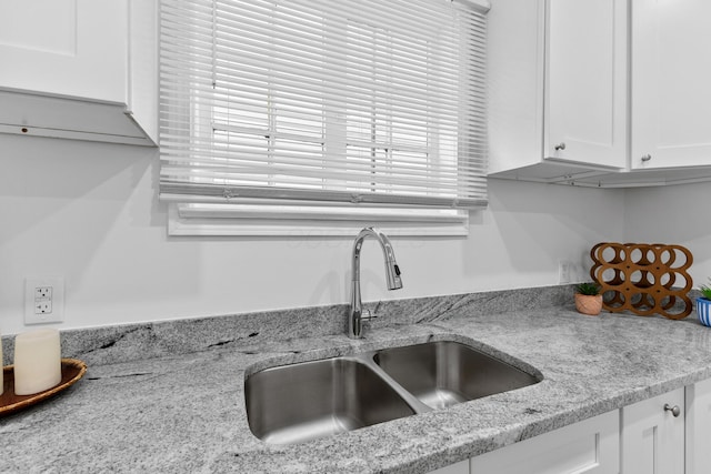 429 S Champion Ave, Columbus, OH 43205 - kitchen with a sink, white cabinets, and light stone countertops