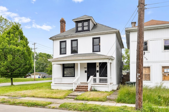 429 S Champion Ave, Columbus, OH 43205 - american foursquare style home with a porch, a chimney, and a shingled roof