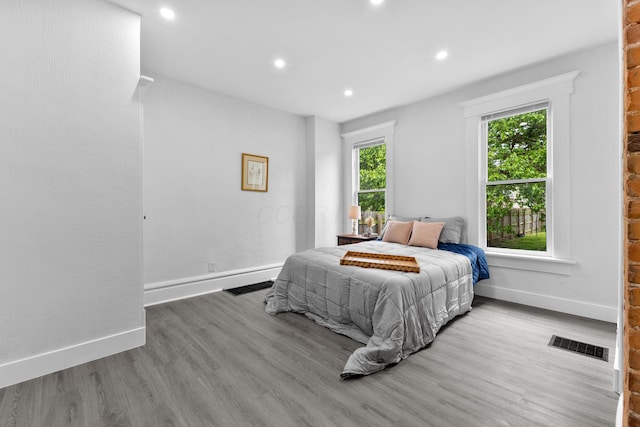 429 S Champion Ave, Columbus, OH 43205 - bedroom featuring baseboards, wood finished floors, and recessed lighting