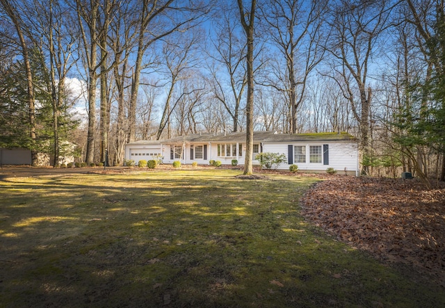 213 Kokosing Dr, Gambier, OH 43022 - view of front of house featuring a garage and a front lawn
