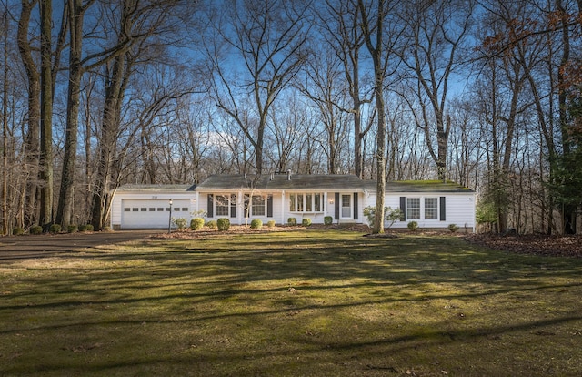 213 Kokosing Dr, Gambier, OH 43022 - ranch-style house with a garage, asphalt driveway, and a front yard