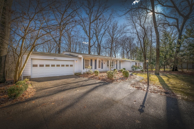 213 Kokosing Dr, Gambier, OH 43022 - ranch-style home featuring asphalt driveway and a garage