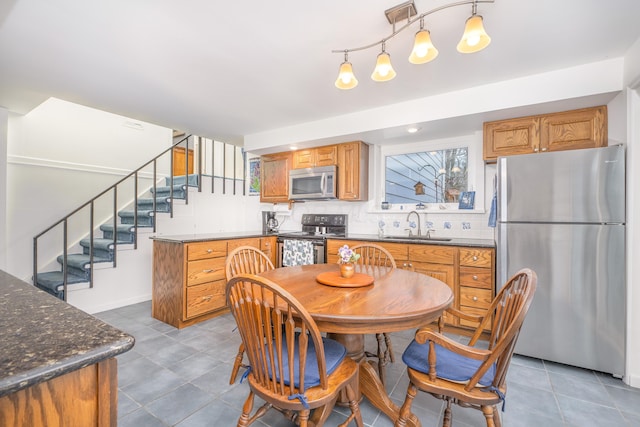 213 Kokosing Dr, Gambier, OH 43022 - dining area with stairway and tile patterned floors