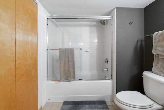 110 N 3rd St Unit 709, Columbus, OH 43215 - full bath with enclosed tub / shower combo, toilet, and tile patterned floors