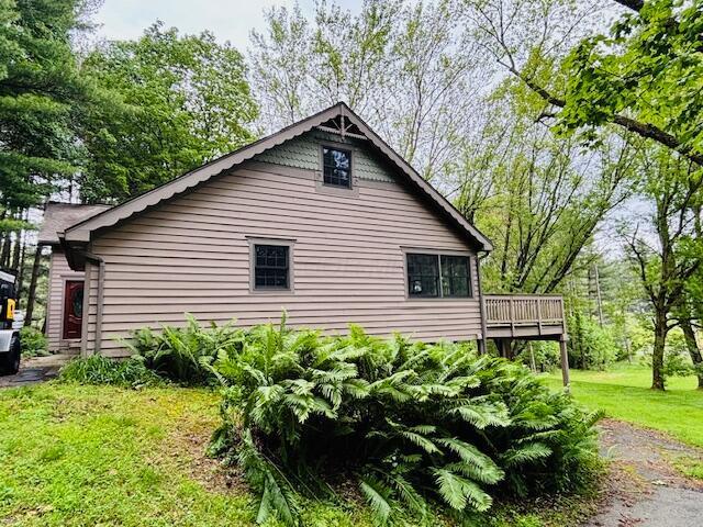 91 Bridle Path Ln, Granville, OH 43023 - view of side of home with a wooden deck