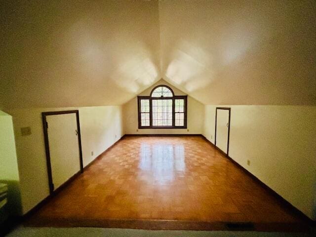 91 Bridle Path Ln, Granville, OH 43023 - additional living space featuring vaulted ceiling and baseboards