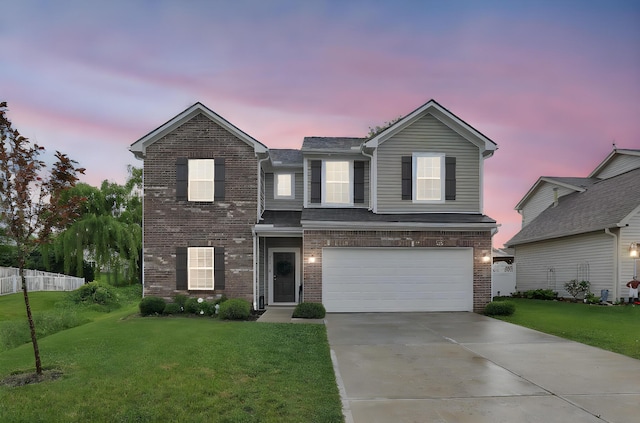 417 Bren Dr, Lancaster, OH 43130 - traditional-style house featuring a front lawn, a garage, brick siding, and concrete driveway