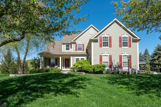 6655 Baronscourt Loop, Dublin, OH 43016 - traditional-style home with a front yard and a porch