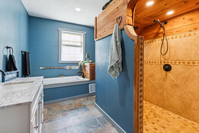 17994 Claypool Rd SE, Newark, OH 43056 - full bath with a bath, baseboards, vanity, tiled shower, and recessed lighting