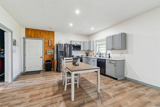 17994 Claypool Rd SE, Newark, OH 43056 - kitchen featuring gray cabinetry, stainless steel appliances, a sink, light wood-style floors, and light countertops