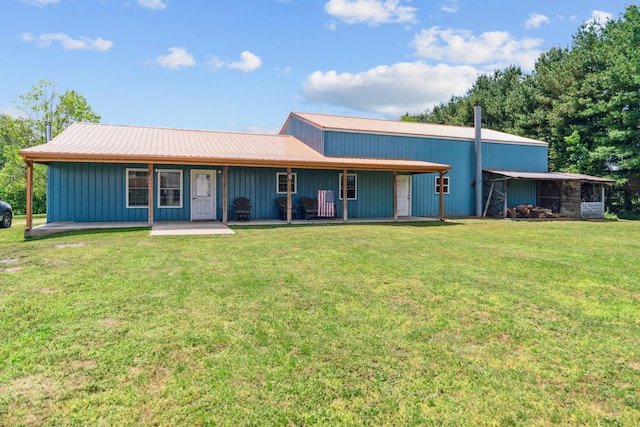 17994 Claypool Rd SE, Newark, OH 43056 - view of front of home featuring metal roof, a front yard, board and batten siding, and covered porch