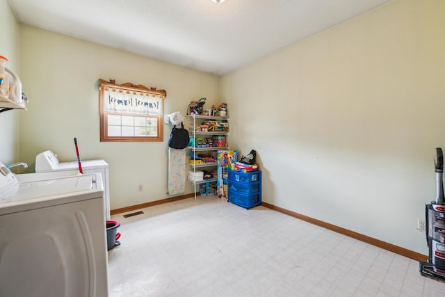 17994 Claypool Rd SE, Newark, OH 43056 - washroom featuring washer and dryer, tile patterned floors, and baseboards