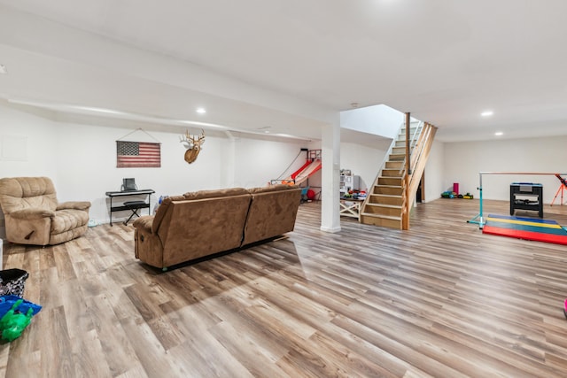17994 Claypool Rd SE, Newark, OH 43056 - living room featuring wood finished floors, stairway, and recessed lighting