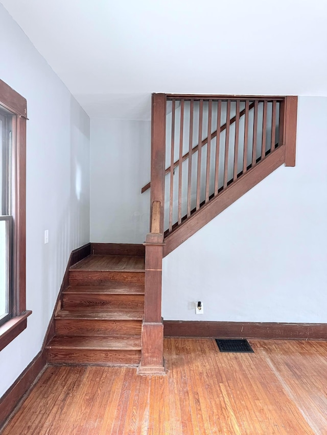 84 E 5th St, London, OH 43140 - stairs featuring baseboards and wood finished floors