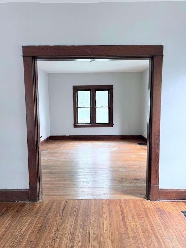 84 E 5th St, London, OH 43140 - spare room featuring wood finished floors and baseboards