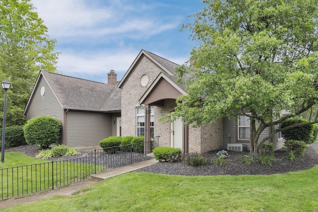 7706 Redman Ln, Reynoldsburg, OH 43068 - view of front of home featuring brick siding, a chimney, and a shingled roof