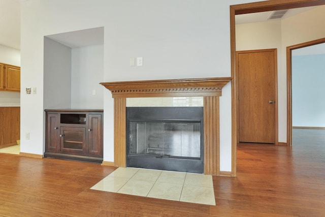 7706 Redman Ln, Reynoldsburg, OH 43068 - detailed view of wood finished floors, a fireplace, and baseboards