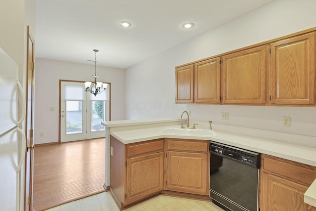7706 Redman Ln, Reynoldsburg, OH 43068 - kitchen with black dishwasher, a sink, a peninsula, light countertops, and recessed lighting
