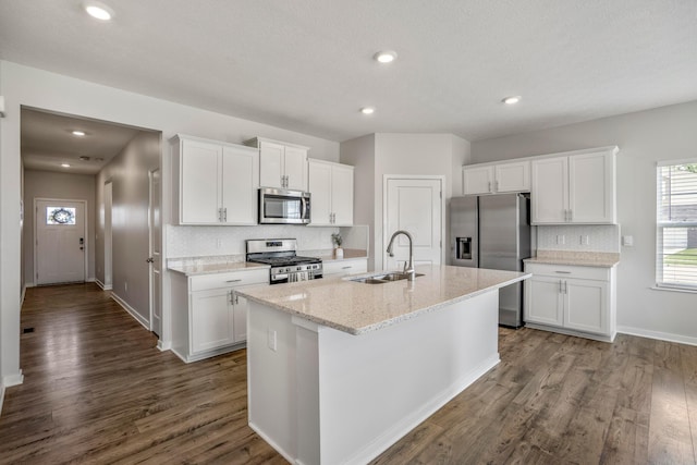 1002 Leslie Dr, Plain City, OH 43064 - kitchen with stainless steel appliances, a sink, tasteful backsplash, white cabinetry, and recessed lighting