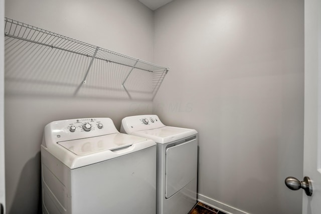1002 Leslie Dr, Plain City, OH 43064 - washroom with washer and clothes dryer and baseboards