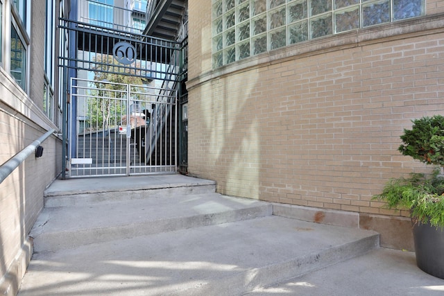 60 E Spring St Unit 327, Columbus, OH 43215 - view of exterior entry featuring brick siding