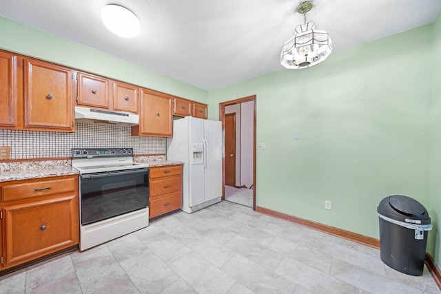 299 Sherwood Downs S, Newark, OH 43055 - kitchen with white appliances, under cabinet range hood, baseboards, backsplash, and brown cabinetry